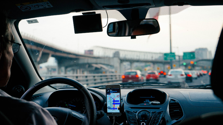 Inside an Uber cab from the rear seat