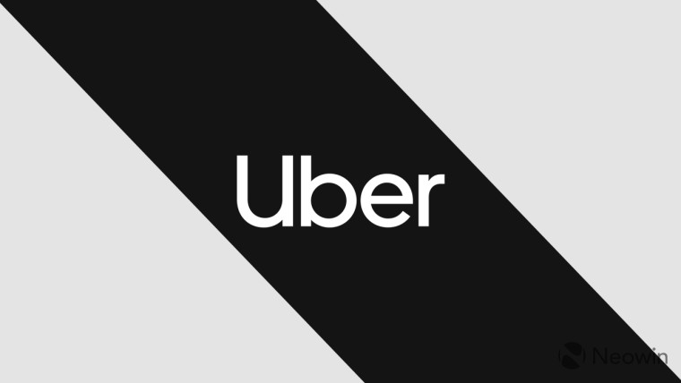 The Uber logo on a grey and black background