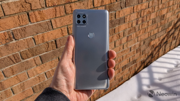 Back of Motorola One 5G Ace with brick background