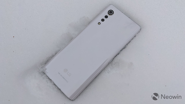 LG Velvet smartphone on top of snow