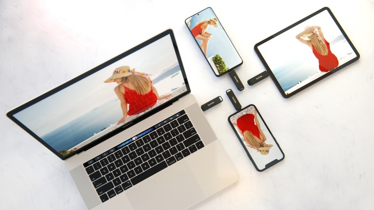 SanDisk iXpand Flash Drive Luxe plugged into multiple devices