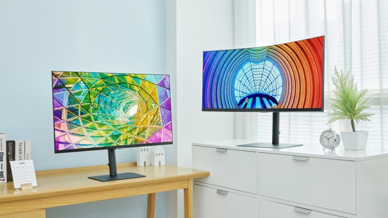 A flat and a curved Samsung high-resolution monitor