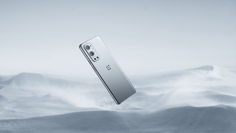 OnePlus 9 Pro in Morning Mist weirdly floating above gray sand