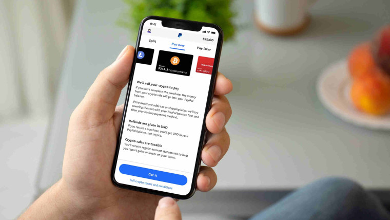 A phone with PayPal&039s Checkout with Crypto
