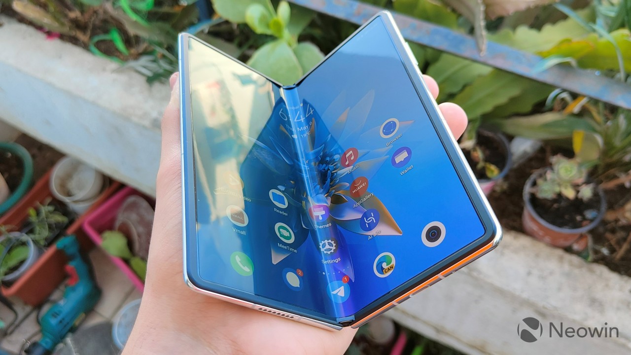 Huawei Mate X2 held in a semi-open position showing the fold on the inner screen