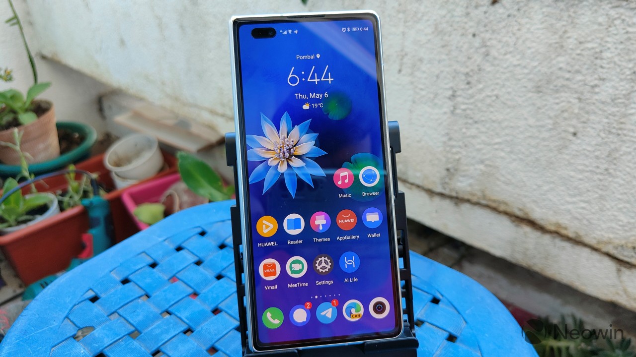 Huawei Mate X2 folded and showing the home screen on its cover display