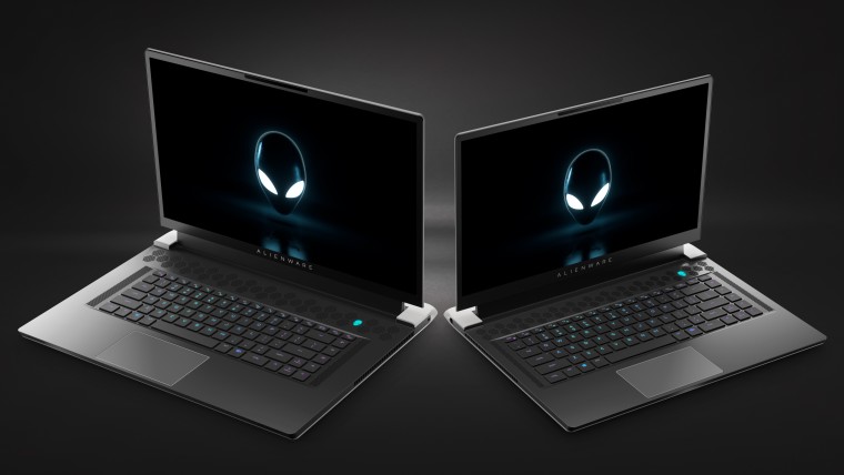 Alienware x17 and x15 laptops with the lids open seen from the front next to each other