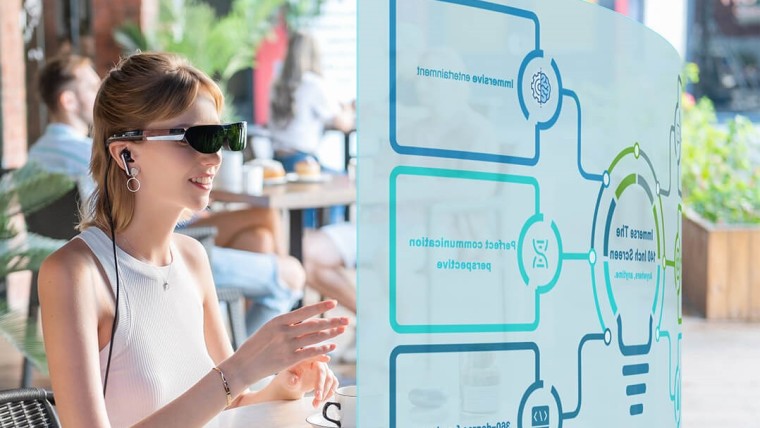 The TCL NxtWear G wearable display being worn by a woman who looks at a virtual screen