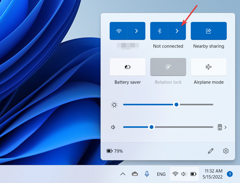 Quick Settings in Windows 11 with an arrow pointing to Bluetooth