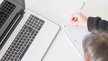 generic person typing on laptop